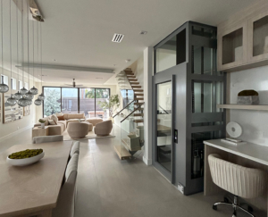 Modern home interior with residential elevator and open living space.