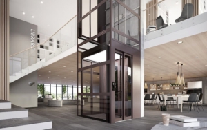 Contemporary glass elevator in a spacious, modern office lobby.