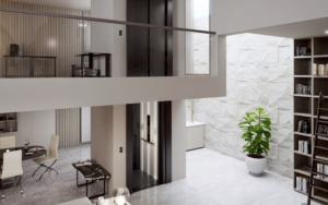Contemporary elevator lobby with sleek design and natural lighting.