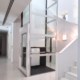 Homeowner comparing shafted and shaftless home elevator options